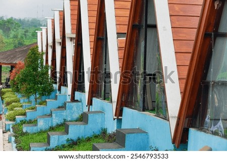Steps, glass, cool colors and many diagonals are found in this place