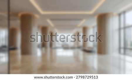 A modern architectural interior featuring columns, natural light, and a spacious design. The image showcases the elegance and contemporary style of the buildings interior.