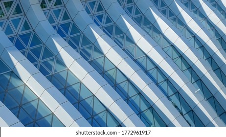 Modern architecture. Abstract pattern of shadows and light on curved diagonal lines of contemporary facade.Fragment of the facade of glass building. - Shutterstock ID 1772961917