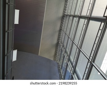 Modern Architecture. Framework Structure Of Hi-tech Interior. Minimal Office Building With Glass And Steel Exterior Wall And Ceiling. Real Estate, Financial Business And Construction Industry.