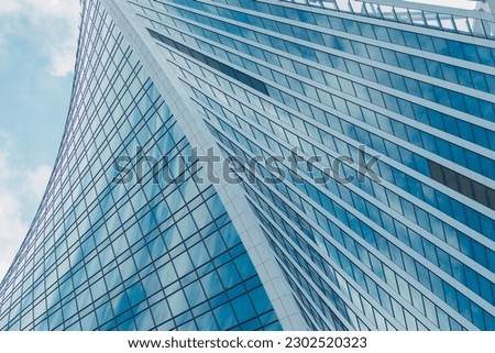 Modern architecture, glass facade of a high-rise building, bottom view, perspective distortions