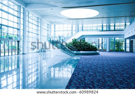 Modern architecture of large business conference center with blue tone.