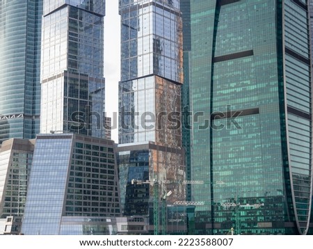   Modern architecture. Made of glass and concrete. Beautiful  new skyscrapers. High-rise buildings in Moscow. Many windows.
