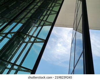 Modern Architecture. Structural Glazing Of Hi-tech Exterior. Minimal Office Building With Glass And Steel Walls And Pillars. Real Estate, Financial Business And Construction Industry. Windows.