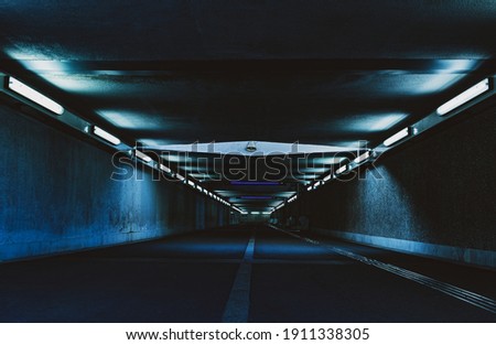 modern architecture of tunnel in the city with dark futuristic lighting