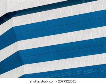 Modern architecture. White and blue football stadium. Building facade. White and blue stripes. Architecture background - Powered by Shutterstock