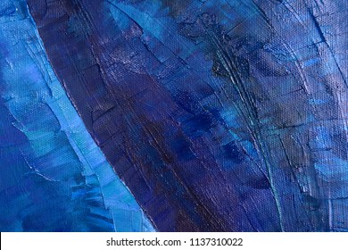 Modern art. Fragment of artwork close up.  Oil paint is applied with large brush strokes on the canvas. Saturated deep blue shades.