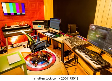 modern asian comtemporary interior design of digital recording and post production studio showing red sound absorber, wooden wall and floor