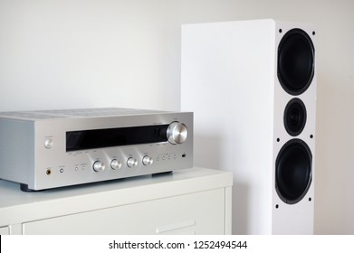 Modern Audio Stereo System With White Speakers On Bureau In Modern Interior