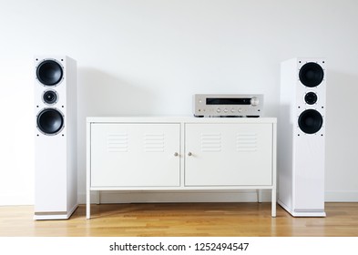 Modern Audio Stereo System With White Speakers On Bureau In Modern Interior