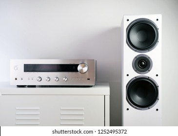 Modern Audio Stereo System With White Speakers On Bureau In Modern Interior