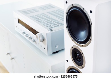 Modern Audio Stereo System With White Speakers On Bureau In Modern Interior