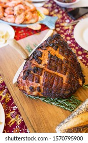 Modern Australian Christmas Dinner Table With Glazed Ham, Prawns, Roast Chicken And Salads.