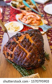 Modern Australian Christmas Dinner Table With Glazed Ham, Prawns, Roast Chicken And Salads.