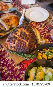 Modern Australian Christmas Dinner Table With Glazed Ham, Prawns, Roast Chicken And Salads.