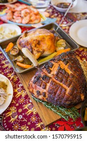 Modern Australian Christmas Dinner Table With Glazed Ham, Prawns, Roast Chicken And Salads.