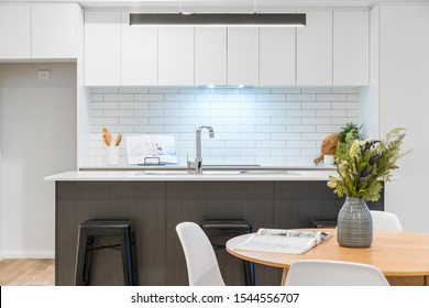 Modern Australian Kitchen Design With Stone Bench Top And Contrasty Colour Scheme. Australian Interior Design.