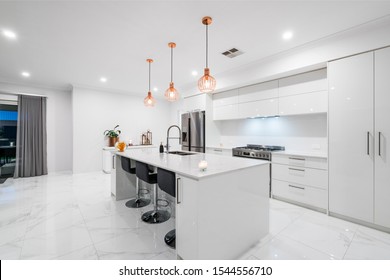 Modern Australian Kitchen Design With Stone Bench Top And Contrasty Colour Scheme. Australian Interior Design.