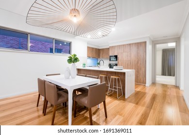 Modern Australian Kitchen Design With Stone Bench Top And Timber Flooring. Australian Interior Design.