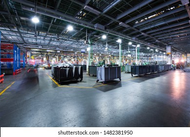 Modern Automatic Automobile Manufacturing Workshop. A Busy Car Production Line. Industrial Scenery Background.