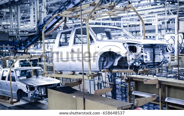 Modern automatic
automobile manufacturing workshop. A busy car production line.
Industrial scenery
background.