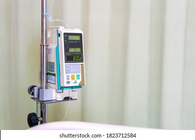 Modern Automatic Infusion Pump For Control Infuses Fluids Medication Or Nutrients Sodium Chloride Saline Solution Fluid Iv Drip With Copy Space