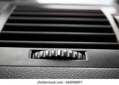Modern automotive car air conditioning (car ventilation vent) and gradient rounded control wheel in black color 