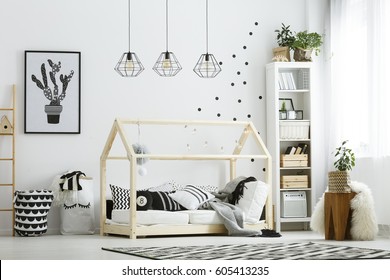 Modern Baby Bedroom In White With Bed, Bookcase, And Carpet