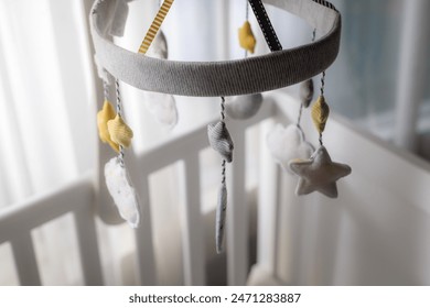 Modern Baby crib with baby mobile in children's room. Interior design - Powered by Shutterstock