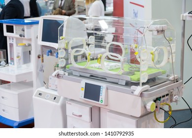 Modern Baby Incubator Isolated. Empty Infant Incubator In An Hospital Room. Nursery Incubator In Hospital. Box For Carrying Premature Babies