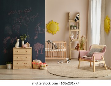 Modern Baby Room Dark Black Board Wall With Chalk, Wooden Cabinet And Cradle Background.