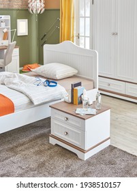 Modern Baby Room Furniture Style With White Wooden Bed And Commode.