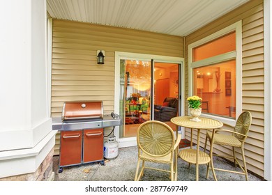 Modern Back Patio With Sliding Glass Door, Window, And Chairs.