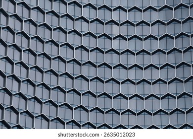 Modern background with hexagonal pattern on glass building, shot in Singapore. 