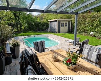 Modern Backyard with Pool and Outdoor Dining Area