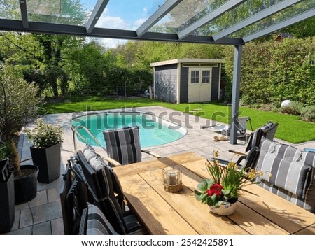 Modern Backyard with Pool and Outdoor Dining Area