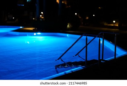 Modern Backyard Water Pool At Night.