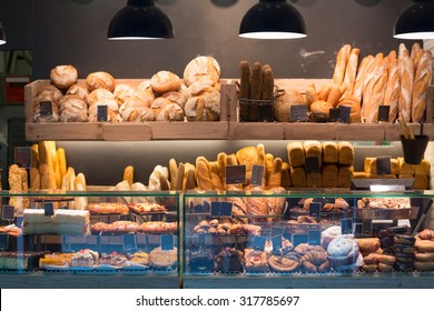 Modern bakery with assortment of bread, cakes and buns  - Shutterstock ID 317785697