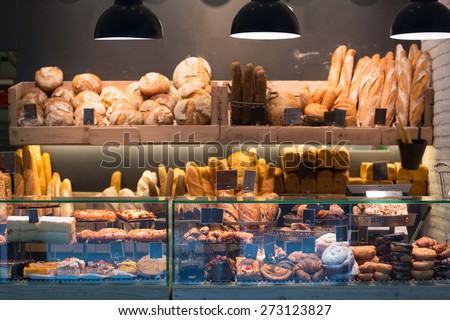 Modern bakery with different kinds of bread, cakes and buns  