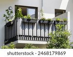 Modern Balcony with Plants. Balcony Railing of Tarpaulin Fabric Privacy Screen Balustrade. Exterior Facade Detail.