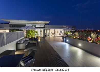 Modern balcony at sunset in luxury penthouse - Shutterstock ID 131580194