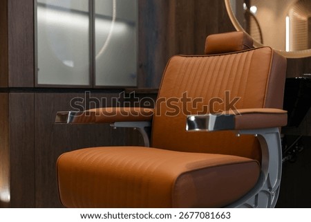 Modern barber shop interior with stylish leather chair in focus, barbershop.