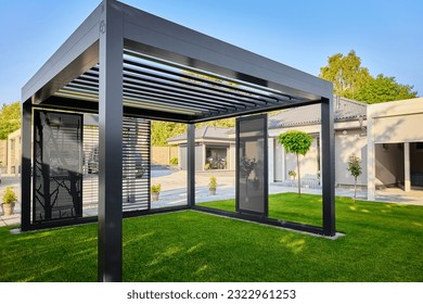 Modern BAT R Bioclimatic Aluminum Pergolas. Experience luxury outdoors with BAT R Bioclimatic Pergolas. Stylish, durable, and customizable – perfect for premium gardens and terraces. - Shutterstock ID 2322961253