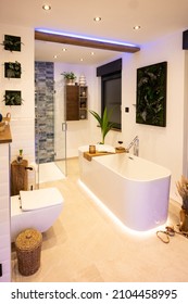 Modern bathroom with freestanding bathtub, modern taps and LED ambient lighting - Shutterstock ID 2104458995