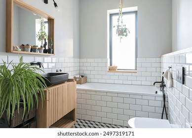 Modern bathroom in industrial design in stylish interior. White tiles, wooden cabinet and mirror and bathroom sink in black colour in new apartment. - Powered by Shutterstock