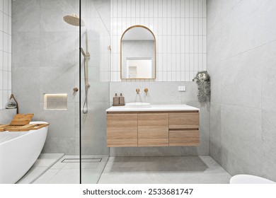 A Modern bathroom interior with wooden vanity, glass shower, and freestanding bathtub - Powered by Shutterstock