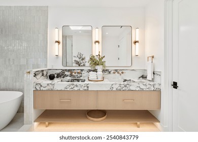 Modern bathroom with marble countertop, dual mirrors, and elegant lighting, featuring a stylish vanity and decorative accents. - Powered by Shutterstock