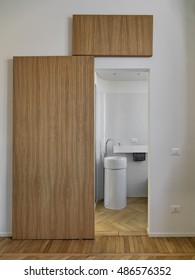 Modern Bathroom With Wooden Floor And Wood Sliding Door