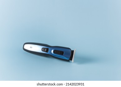 Modern Battery Electric Shaver for Man on Blue Background Horizontal Copy Space