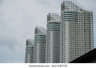 Modern Baywalk Apartment Buildings Shot From Muara Angke Port Under Cloudy Sky